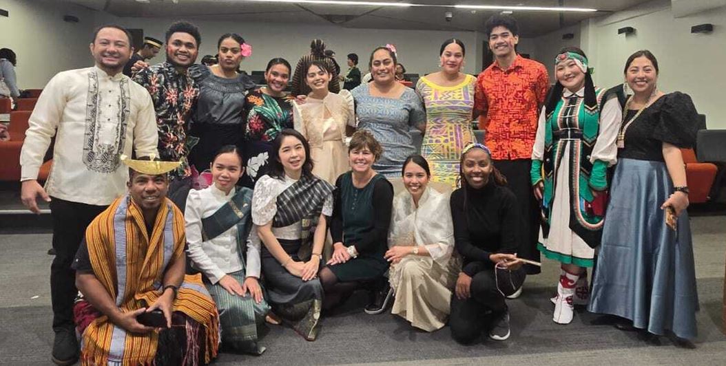 A group of people smiling for a photo.