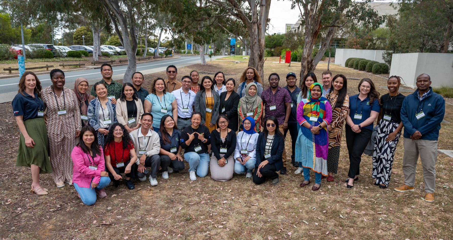 A group of people outside smiling for a photo.