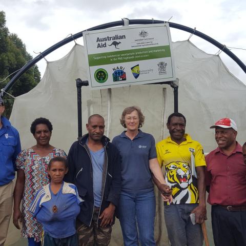 Irene Kernot, centre, with researchers and farmers taking part in an ACIAR-supported sweetpotato project in Papua New Guinea. Photo: ACIAR